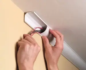 How to hide speaker wire with hardwood floors